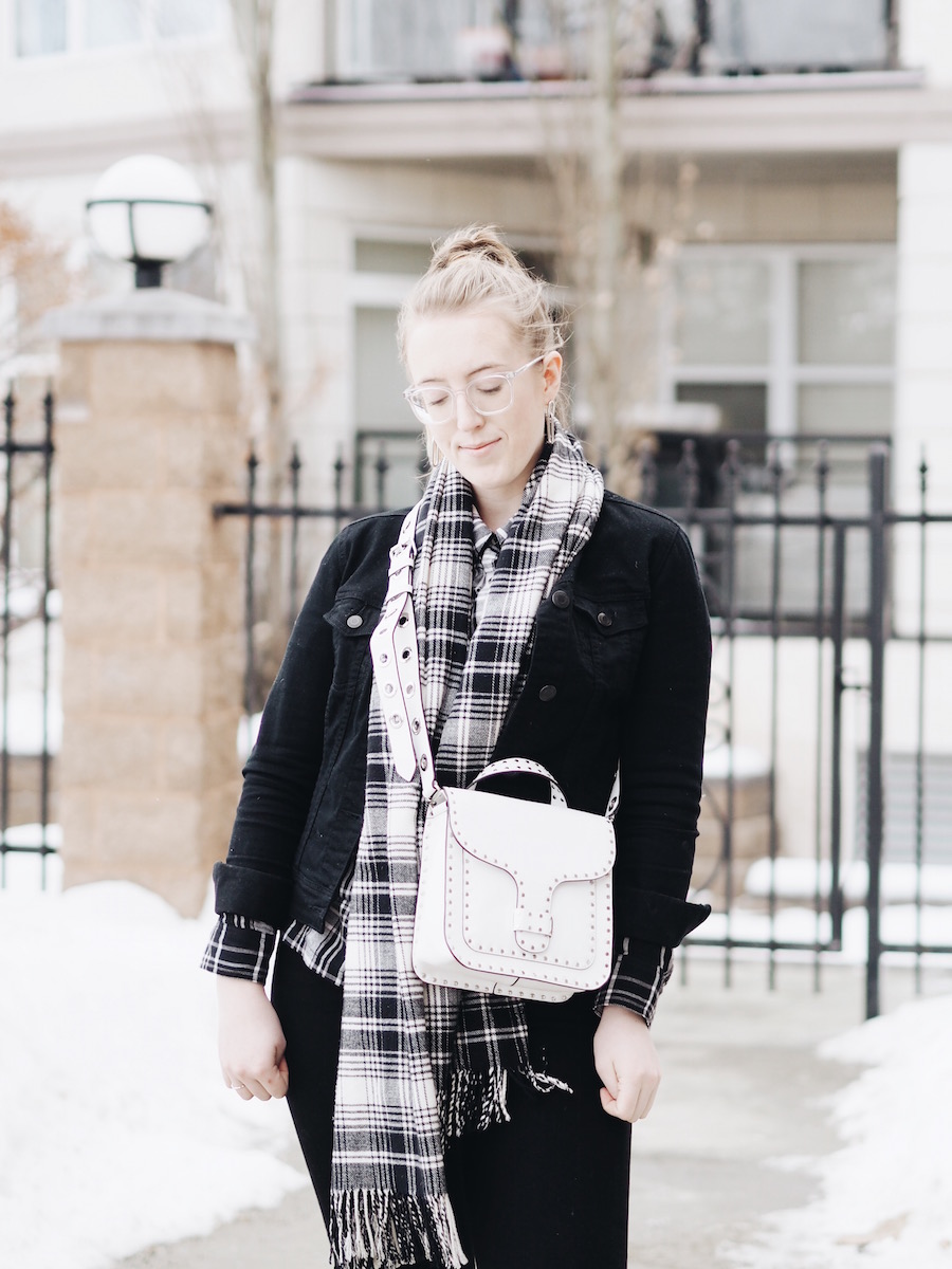 Matching Plaid and black denim pieces with straight leg jeans and white accessories