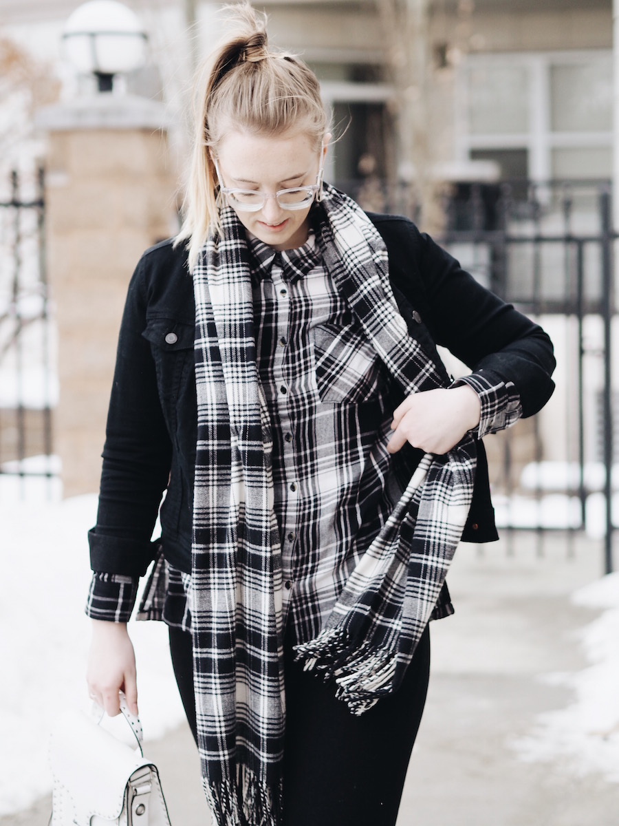 Matching Plaid and black denim pieces with straight leg jeans and white accessories