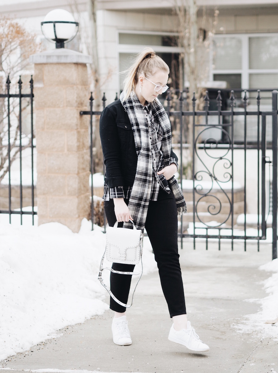 Matching Plaid and black denim pieces with straight leg jeans and white accessories