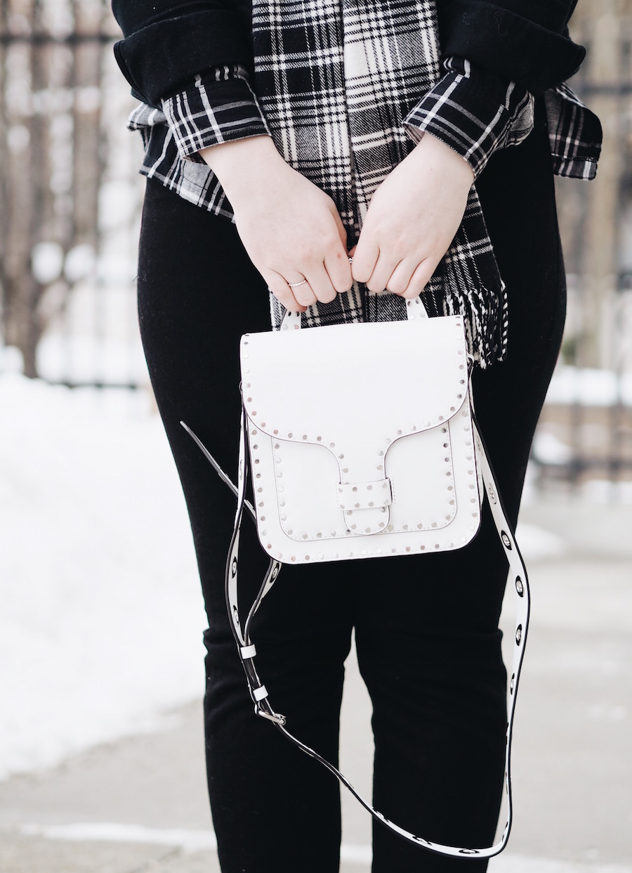 Matching Plaid and black denim pieces with straight leg jeans and white accessories