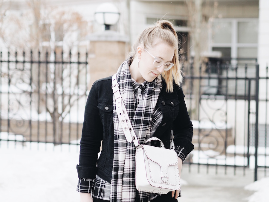 Matching Plaid and black denim pieces with straight leg jeans and white accessories