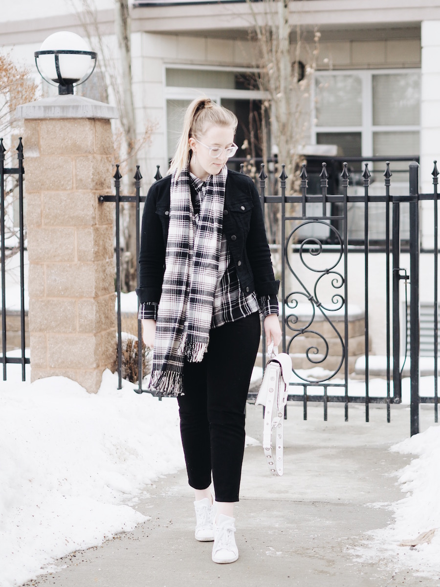 Matching Plaid and black denim pieces with straight leg jeans and white accessories