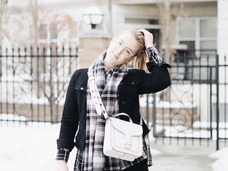 Matching Plaid and black denim pieces with straight leg jeans and white accessories